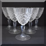 G51. 9 Pressed glass wine glasses. 9”h - $54 